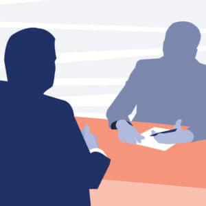 Graphic of interviewer and interviewee sitting on opposite sides of a desk