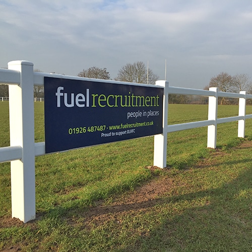 Fuel Recruitment logo on a banner on a white fence