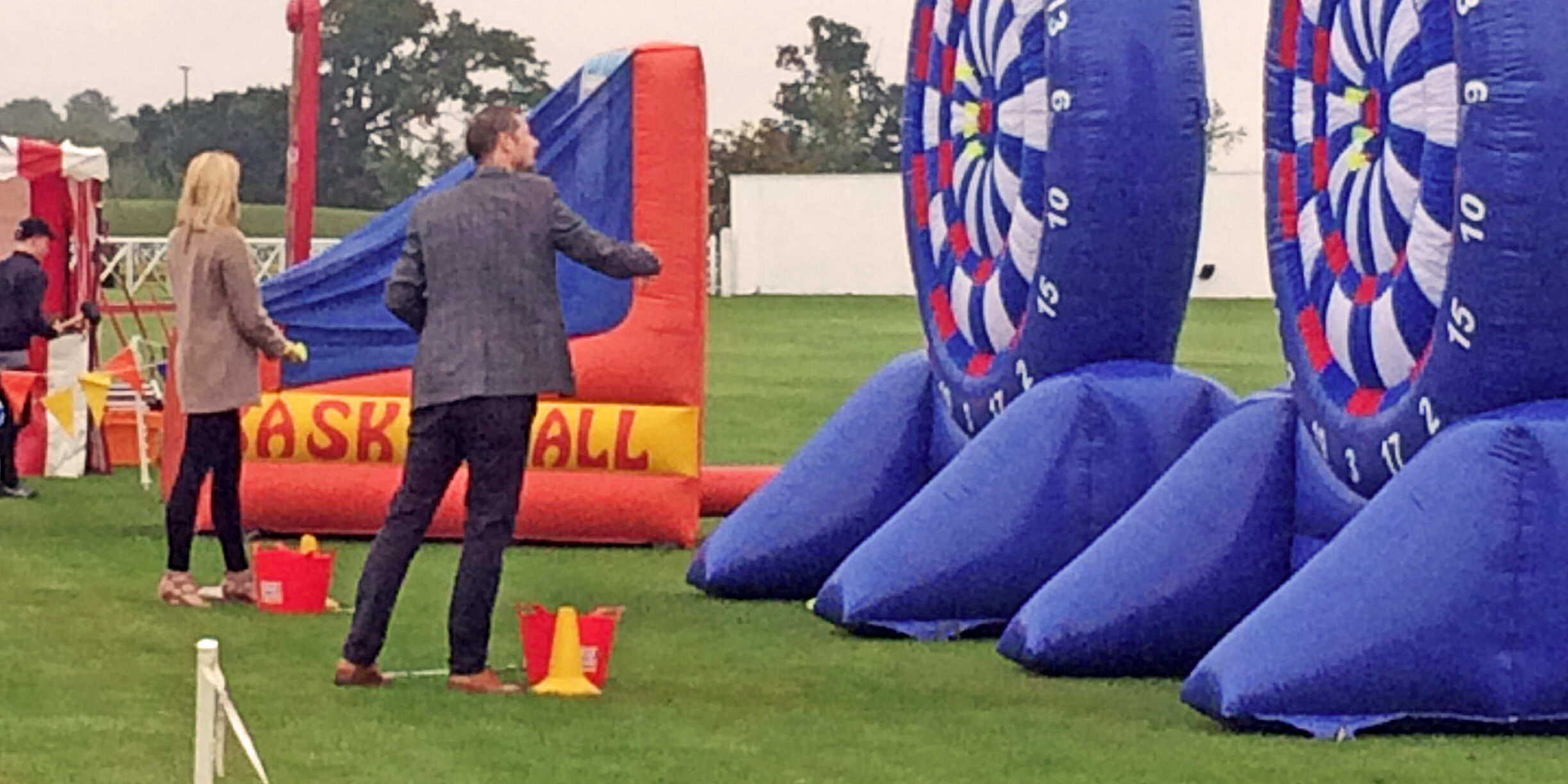 Darts_square Charity darts game in front of a giant inflatable dart board