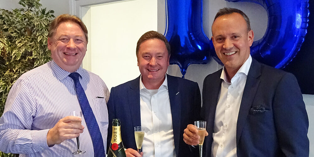Fuel_15_3 Mark Esom, Steve Willmore and Murray West celebrate 15 years of Fuel Recruitment with champagne, cake and balloons