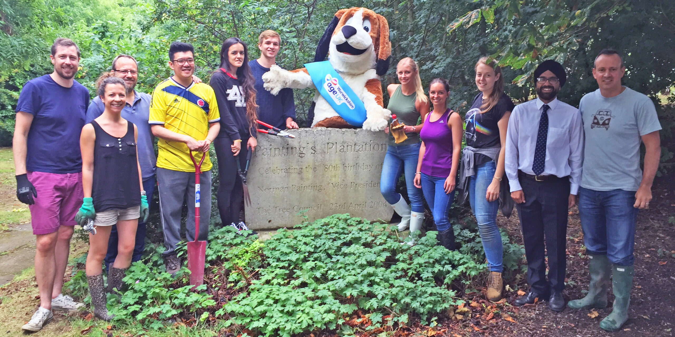 Fuel Recruitment volunteering for Age UK Fuel Recruitment team volunteering for Age UK posing for photograph with Harvey the Hound