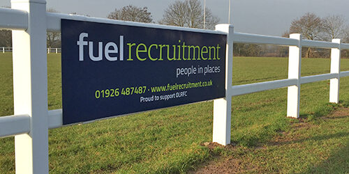 Old Leamingtonians_sm Fuel Recruitment logo on a banner on a white fence